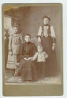  From left to right, Ada Speed (daughter), Nancy Caroline (Cally) Burgess Speed (mother, seated), Bobby Brown (gandson), and Adella Speed Brown (daughter of Cally and mother of boy).